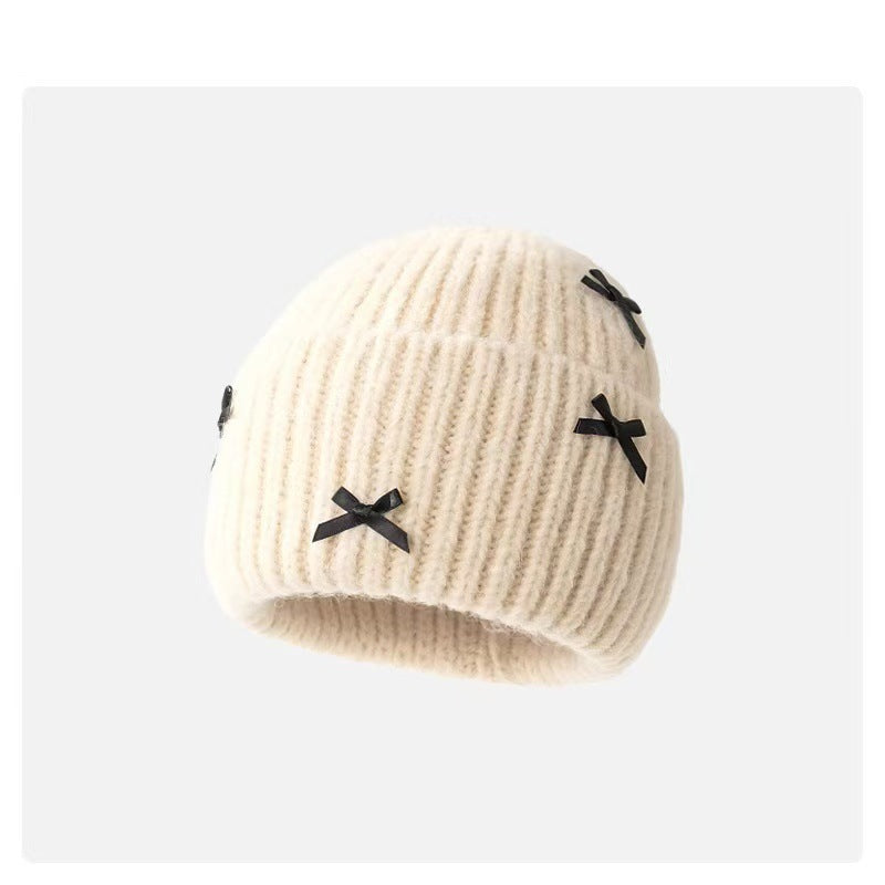 Wholesale Sweet woolen hat with bow for autumn and winter